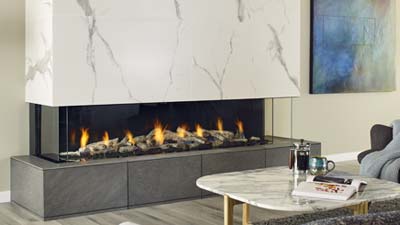 Extra-Large fireplace with a 72" linear burner. The clean uninterrupted view of the flame is enhanced by three sides of viewing and is zero clearance for design flexibility. It can be framed in as a corner unit as well and is only available with a power vent.