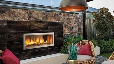Small outdoor fireplace with the option of a framing kit. This unit can have either a clean edge finish or be ordered with a stainless steel surround.